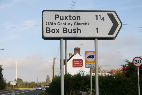 A signpost to Puxton on the A370 at Hewish